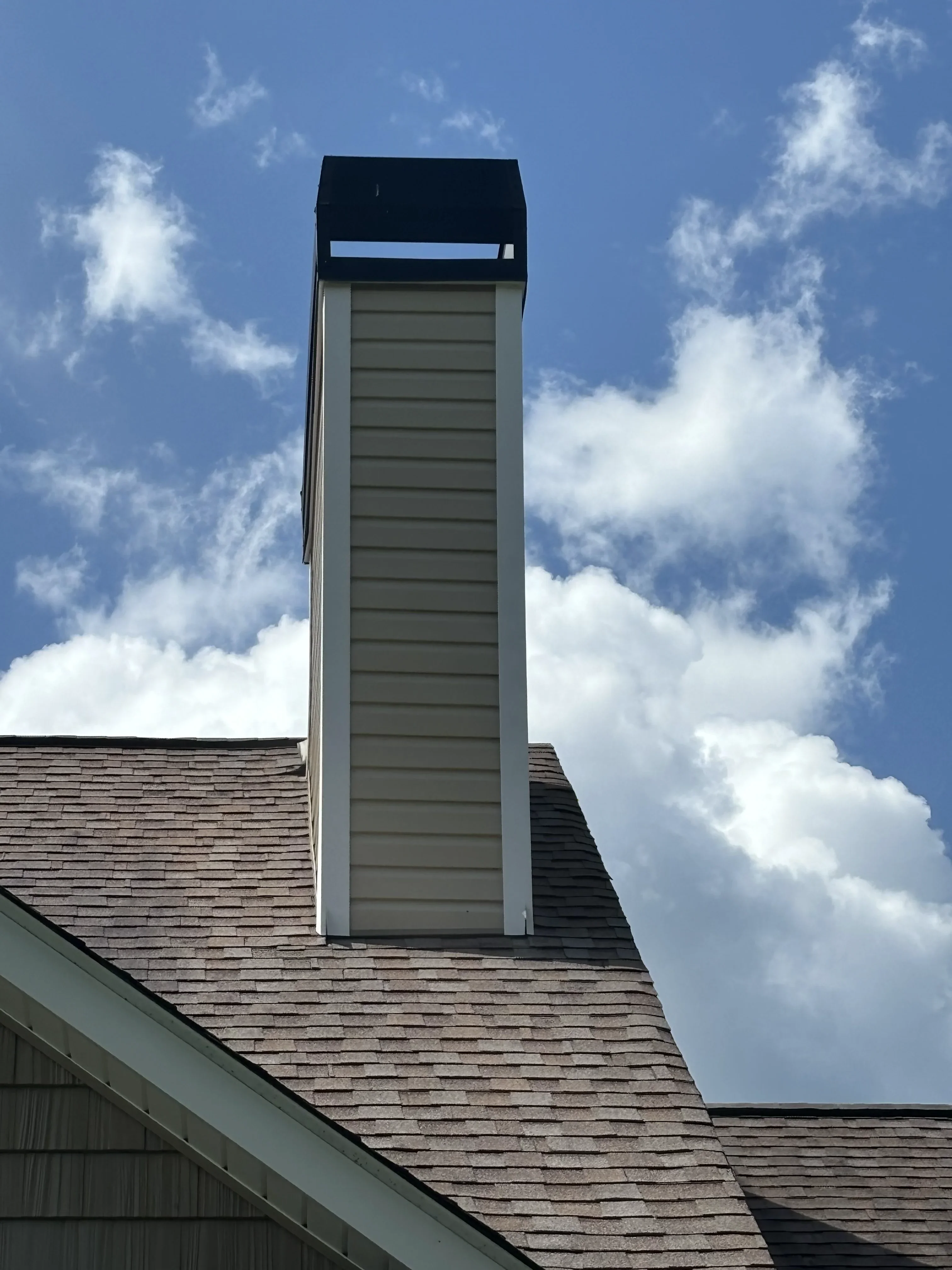 Chimney restored to original color after pressure washing
