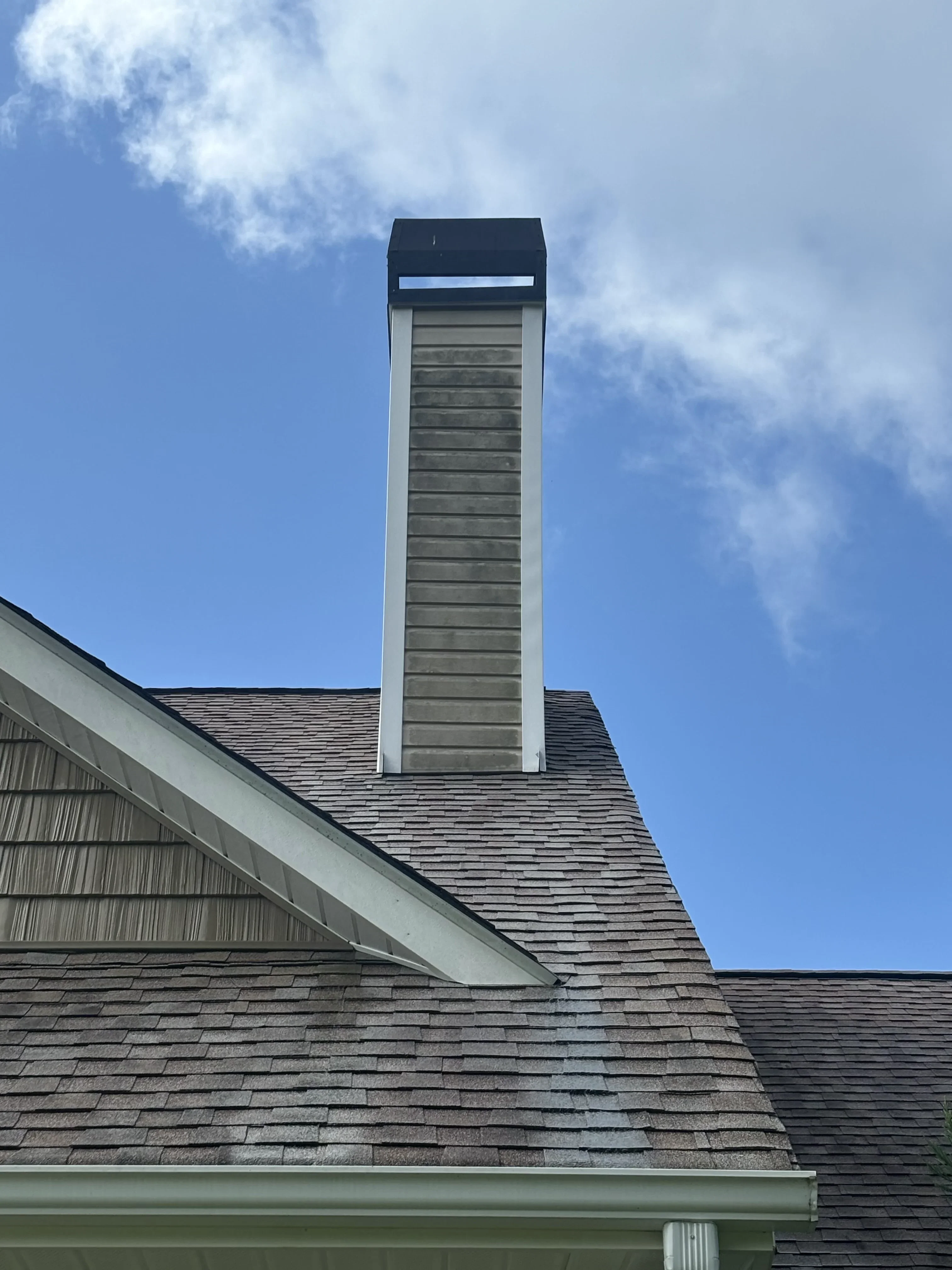 Chimney with dark stains and dirt before cleaning